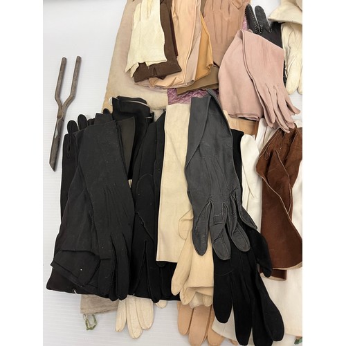 283 - A large quantity of vintage gloves and a pair of glove stretchers