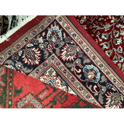 713 - Two Persian style rugs, one with cream and red all over stylized design with some stains, 187cm x 13... 