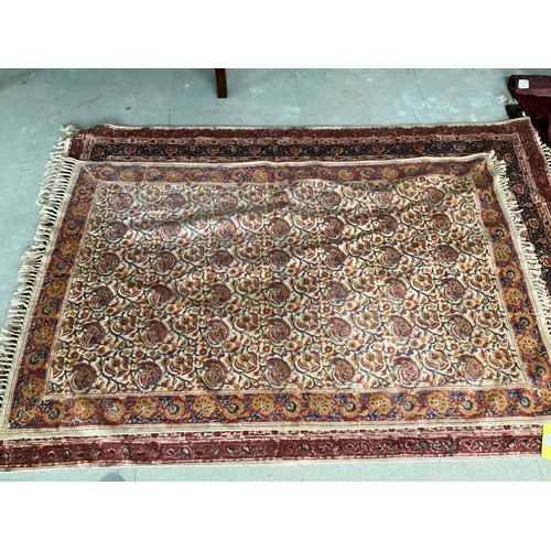 701 - FIVE rugs: A red ground Persian style rug, 158 x 102cm; another with brown ground and  central navy ... 