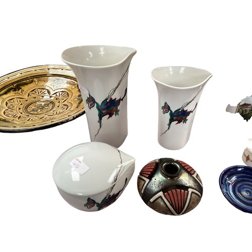 414 - A collection of ceramic items to include a Arabic style charger, two modern printed Steins, three pi... 