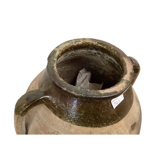 541 - A large bulbous teracotta olive pot /garden urn with two handles and etched decoration, rustic and r... 