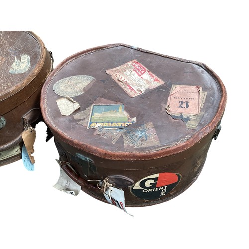 195 - Two travelling hat trunks with numerous applied travel stickers, Orient Line etc,