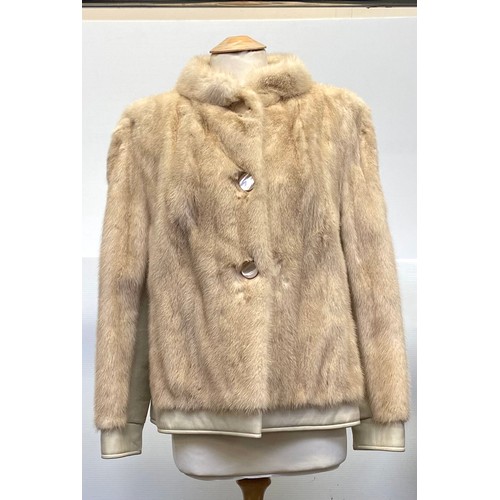 302 - A ladies cream leather and fur bomber jacket Gerhardt Kansas City label (wear to the lining); a thre... 