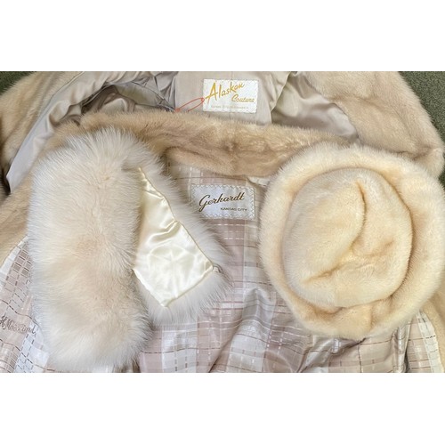 302 - A ladies cream leather and fur bomber jacket Gerhardt Kansas City label (wear to the lining); a thre... 