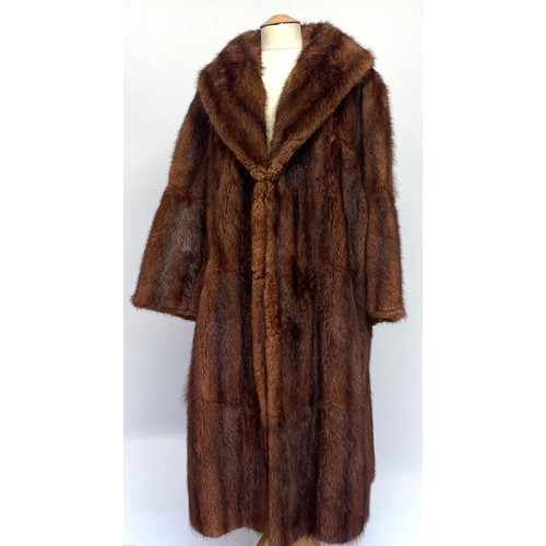 306 - A vintage two tone brown fur coat labelled J Bryer Harrogate, along with a two tone brown fur stole,... 