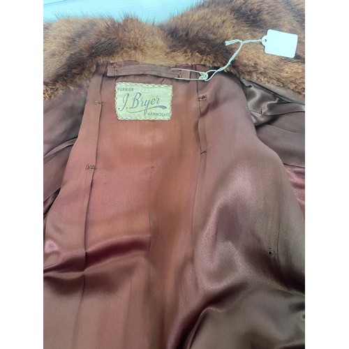 306 - A vintage two tone brown fur coat labelled J Bryer Harrogate, along with a two tone brown fur stole,... 