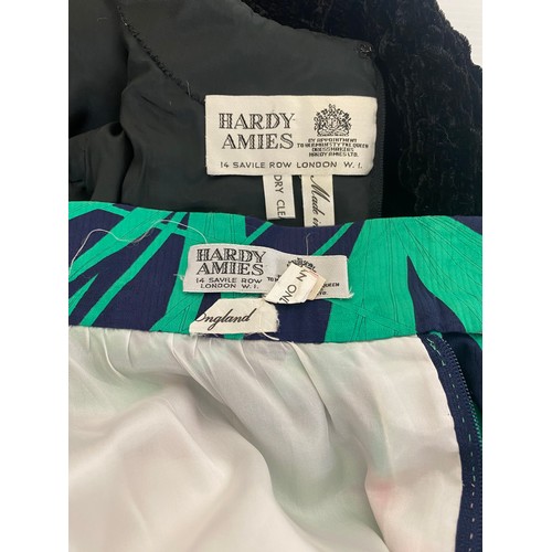 312 - A Hardy Amies black roushed velvet top;  and a Hardy Amies green, pink and navy floral pattern long ... 