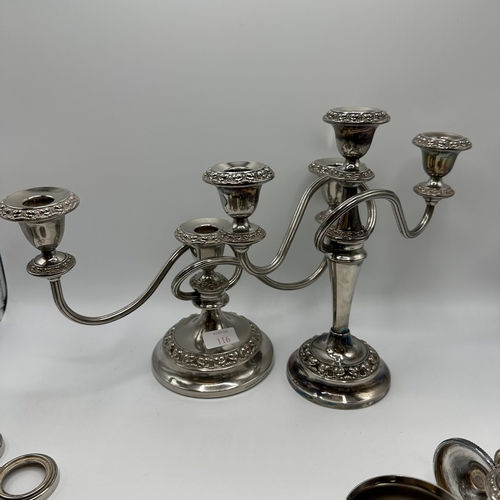 116 - A good collection of silver plated wares to include condiments, vases coasters , candlesticks cream ... 