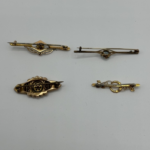 13 - Four 9ct gold bar brooches. One set with ruby and pearl and another aquamarine set. 6.6g