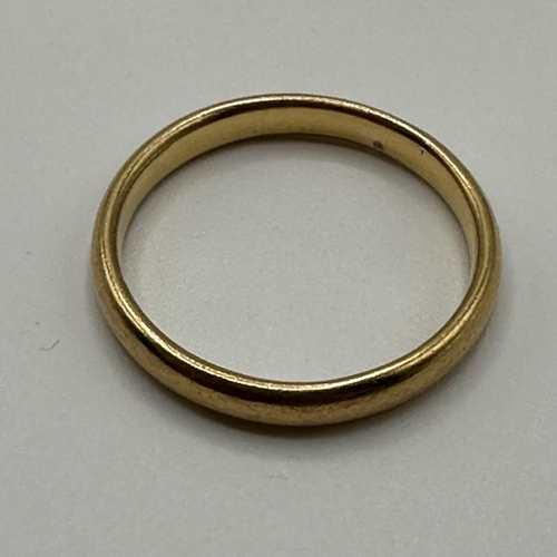 21 - A 22ct gold wedding band. Size P. 4.20g.