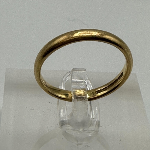 21 - A 22ct gold wedding band. Size P. 4.20g.