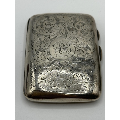 28 - A sterling silver hip shaped cigarette case together with a white metal sovereign holder and vesta i... 