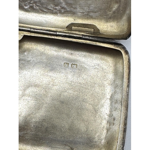 28 - A sterling silver hip shaped cigarette case together with a white metal sovereign holder and vesta i... 