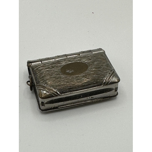 28 - A sterling silver hip shaped cigarette case together with a white metal sovereign holder and vesta i... 