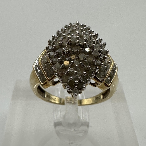 3 - A 10ct gold and diamond cluster ring. Navette shaped cluster set with single cut diamonds and a doub... 