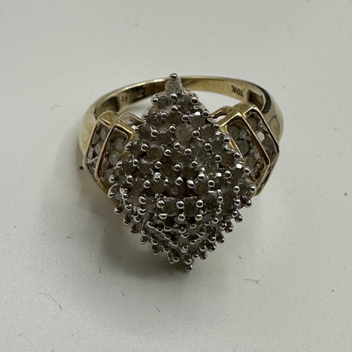 3 - A 10ct gold and diamond cluster ring. Navette shaped cluster set with single cut diamonds and a doub... 