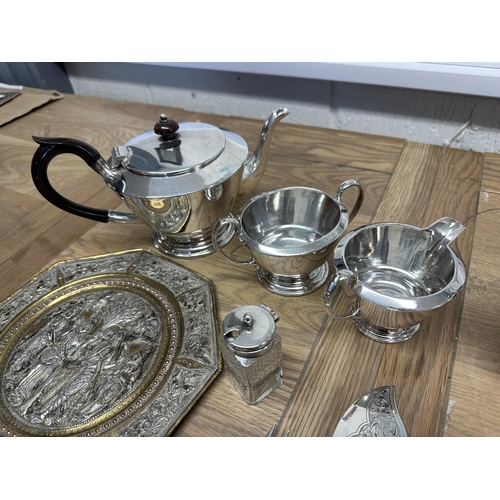 68 - A collection of silver plated wares to include an Art Deco style three pieces tea service  and other... 