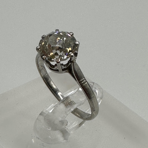 82 - An unmarked white metal (tests platinum)single stone diamond ring. Single old cut diamond in an eigh... 