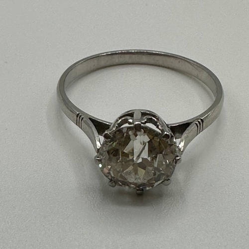 82 - An unmarked white metal (tests platinum)single stone diamond ring. Single old cut diamond in an eigh... 