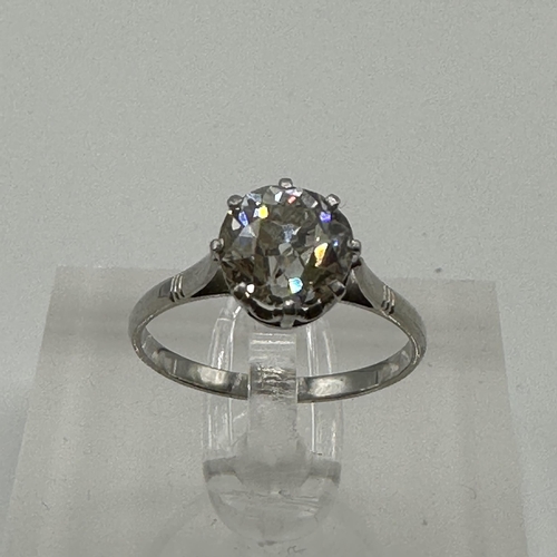 82 - An unmarked white metal (tests platinum)single stone diamond ring. Single old cut diamond in an eigh... 