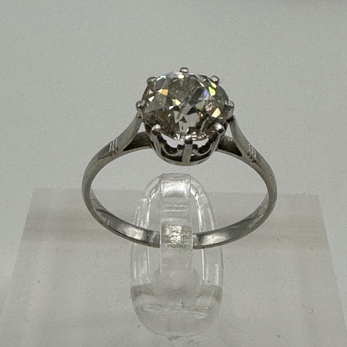 82 - An unmarked white metal (tests platinum)single stone diamond ring. Single old cut diamond in an eigh... 