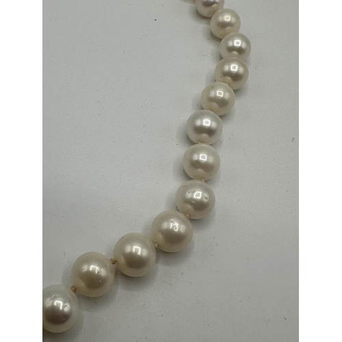 9 - A strand of large uniform pearls with 18ct gold clasp. approx 13mm pearls. 45cm.