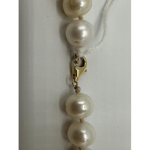 9 - A strand of large uniform pearls with 18ct gold clasp. approx 13mm pearls. 45cm.