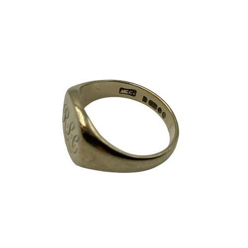 128 - A 9ct gold gents signet ring. 7.1g. Size R.