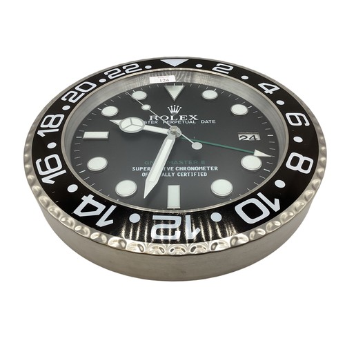 124 - A Rolex Oyster perpetual GMT Master II wall clock. 34cm