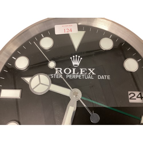 124 - A Rolex Oyster perpetual GMT Master II wall clock. 34cm