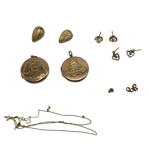 131 - A collection of gold items . Two 9ct regimental lockets, 14ct gold earrings , ear studs and yellow m... 