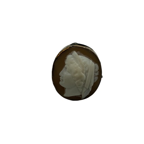 135 - An unmarked yellow metal cameo ring together with an Etruscan style yellow metal brooch.