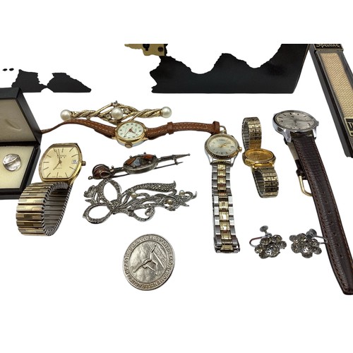 133 - A collection of sterling silver white metal, and costume jewellery and fashion watches , contained w... 