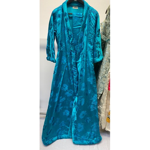 221 - A quantity of Vintage clothing to include a DYNASTY Hong Kong turquoise padded dressing gown/house c... 