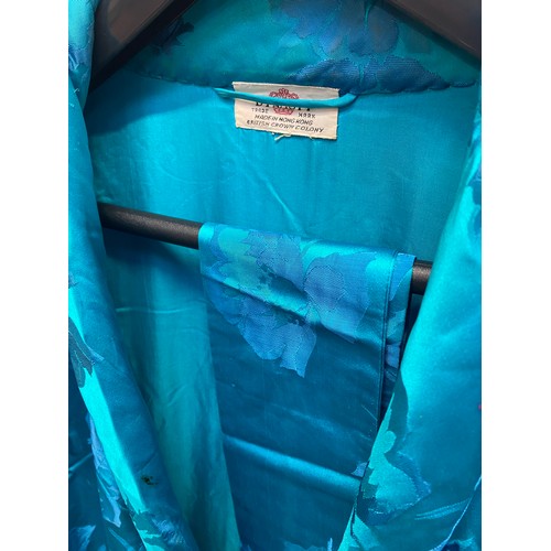 221 - A quantity of Vintage clothing to include a DYNASTY Hong Kong turquoise padded dressing gown/house c... 