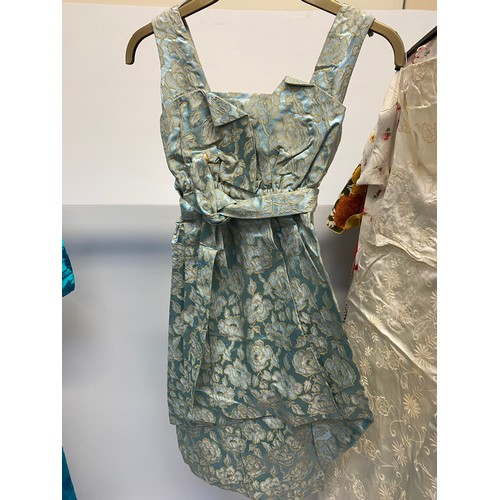 221 - A quantity of Vintage clothing to include a DYNASTY Hong Kong turquoise padded dressing gown/house c... 