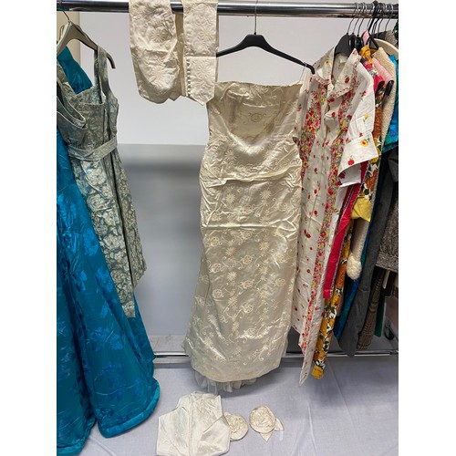 221 - A quantity of Vintage clothing to include a DYNASTY Hong Kong turquoise padded dressing gown/house c... 