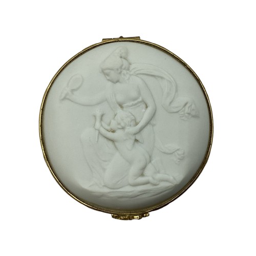 140 - A Limoges, porcelain and gilt metal circular box with raised classical scene 8cm(d)