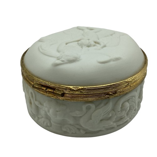 140 - A Limoges, porcelain and gilt metal circular box with raised classical scene 8cm(d)