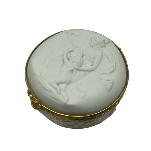 140 - A Limoges, porcelain and gilt metal circular box with raised classical scene 8cm(d)