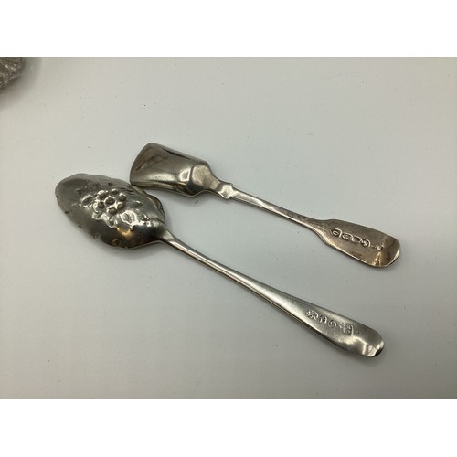 67 - A collection of sterling silver items to include sugar tongs flatware and silver topped glass items.... 