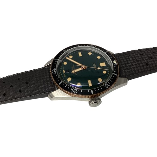 123 - Oris. A Gentleman's Wristwatch. Bronzed and black enamel bezel. Green 30mm face. Original box, outer... 