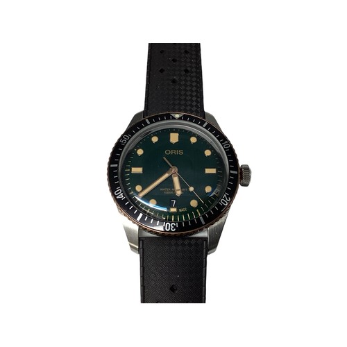 123 - Oris. A Gentleman's Wristwatch. Bronzed and black enamel bezel. Green 30mm face. Original box, outer... 