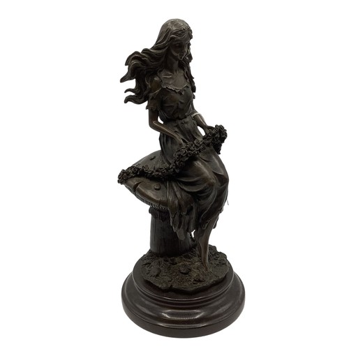 345 - After Jean Patou (1880-1936). Bronze figure of a girl seated upon a toadstool. Etched signature on a... 