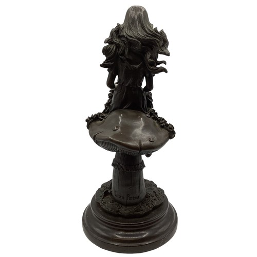 345 - After Jean Patou (1880-1936). Bronze figure of a girl seated upon a toadstool. Etched signature on a... 