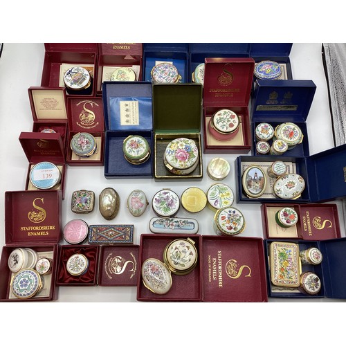 139 - A large collection of Limoges, past times ,Staffordshire enamels and engine turned white metal boxes... 