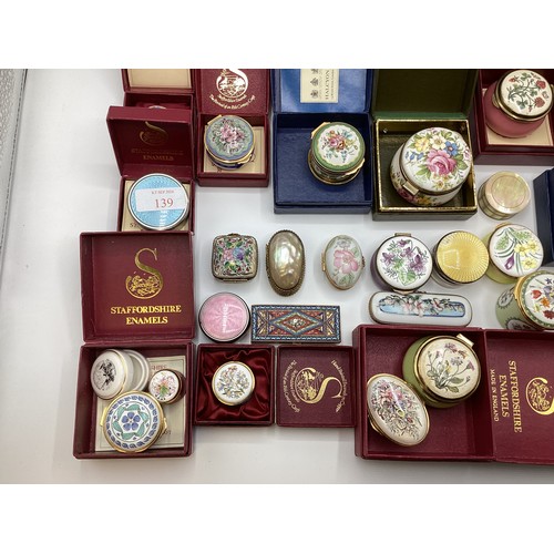 139 - A large collection of Limoges, past times ,Staffordshire enamels and engine turned white metal boxes... 