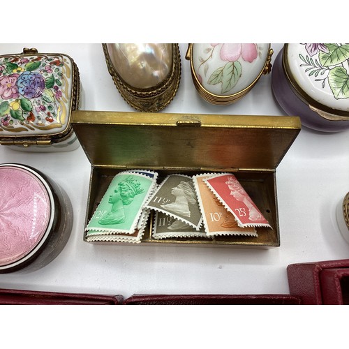 139 - A large collection of Limoges, past times ,Staffordshire enamels and engine turned white metal boxes... 