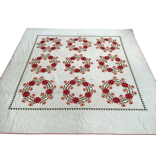 155 - Two American quilts, one with all over red and orange floral pattern, with some stains 230 x 236cm, ... 