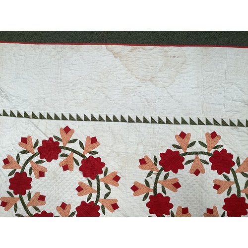 155 - Two American quilts, one with all over red and orange floral pattern, with some stains 230 x 236cm, ... 